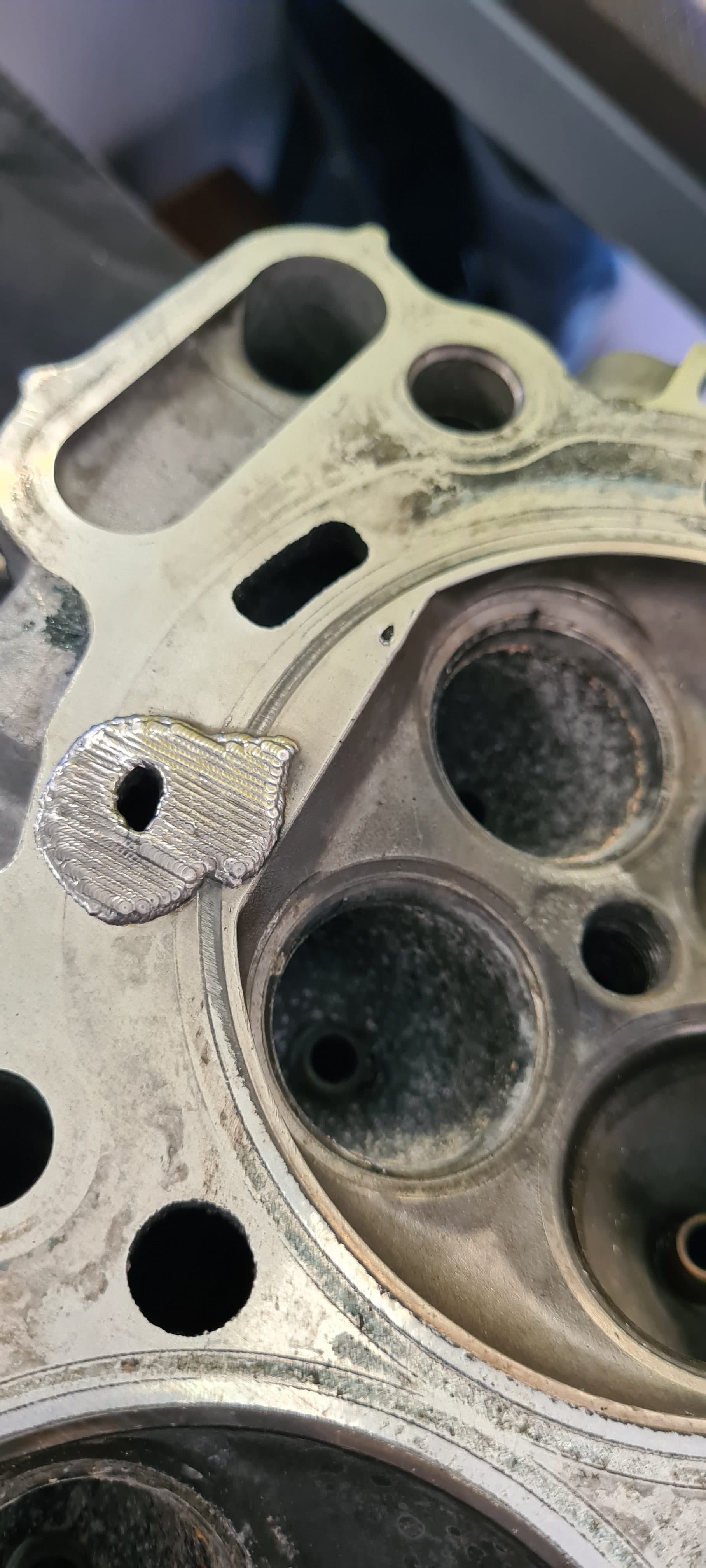 Laser weld repair on a damaged valve seat area