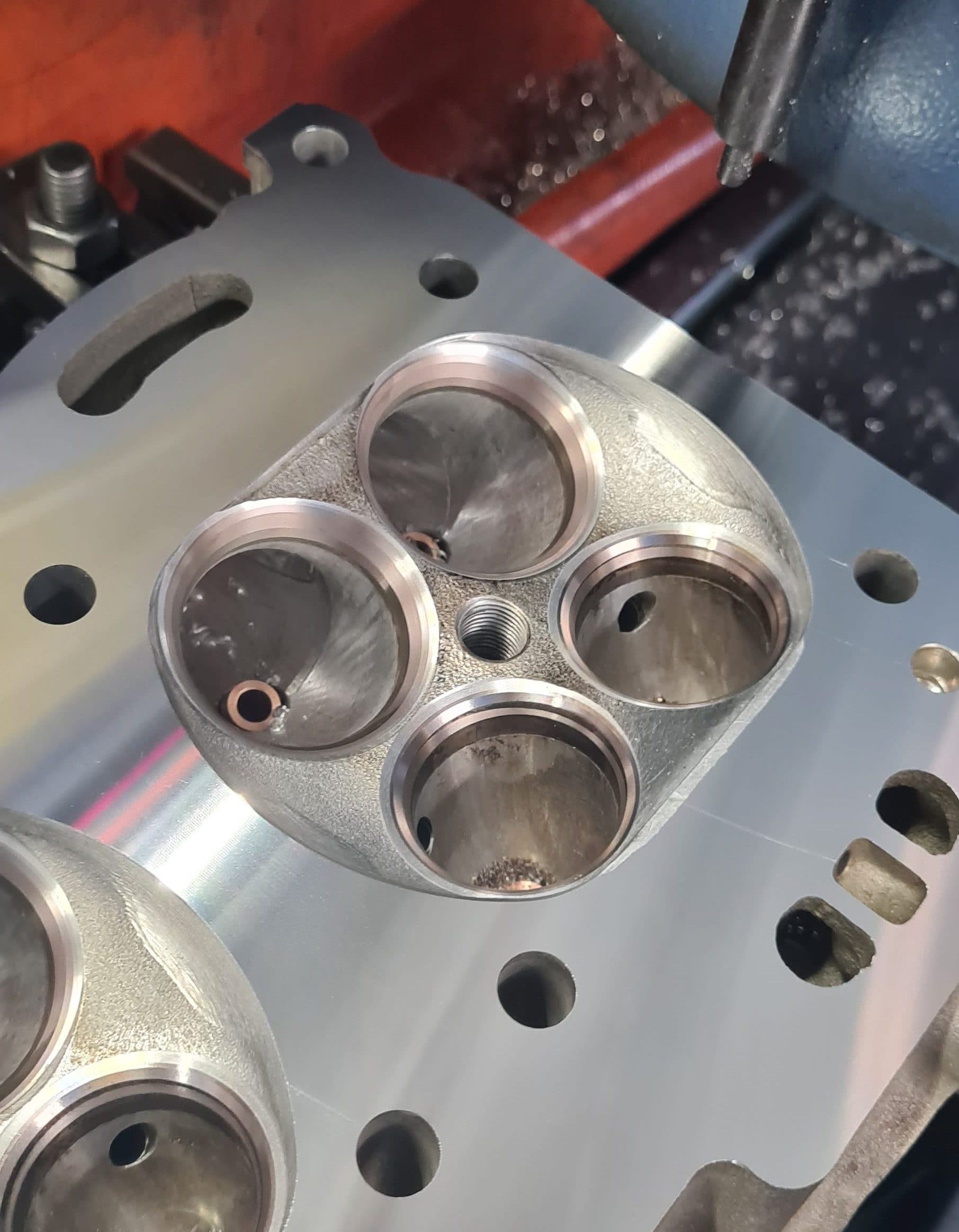 CNC-machined valve seats and ports of a cylinder head with a burnished surface