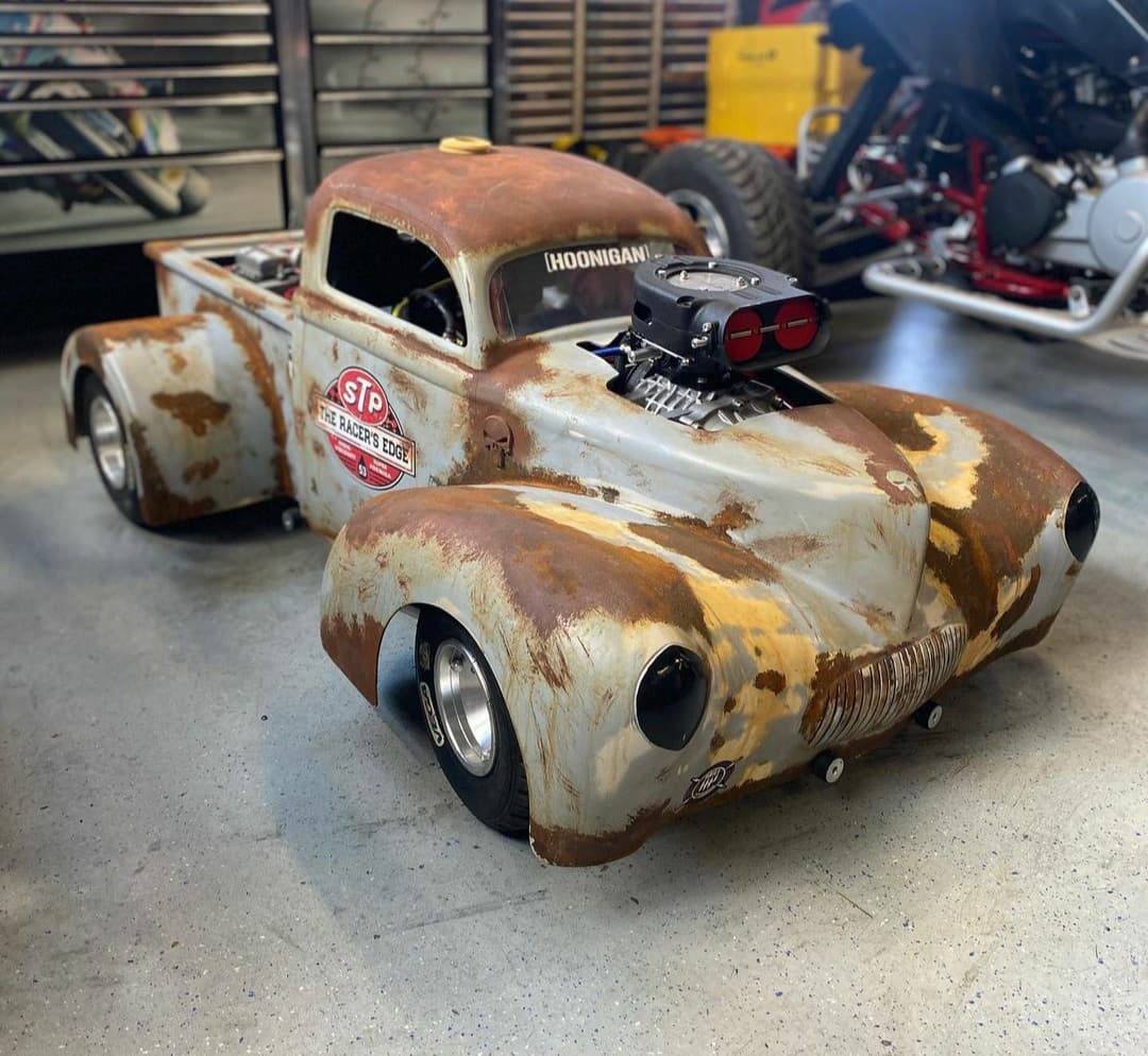 Rat-rod pickup with top-mounted supercharger in the workshop