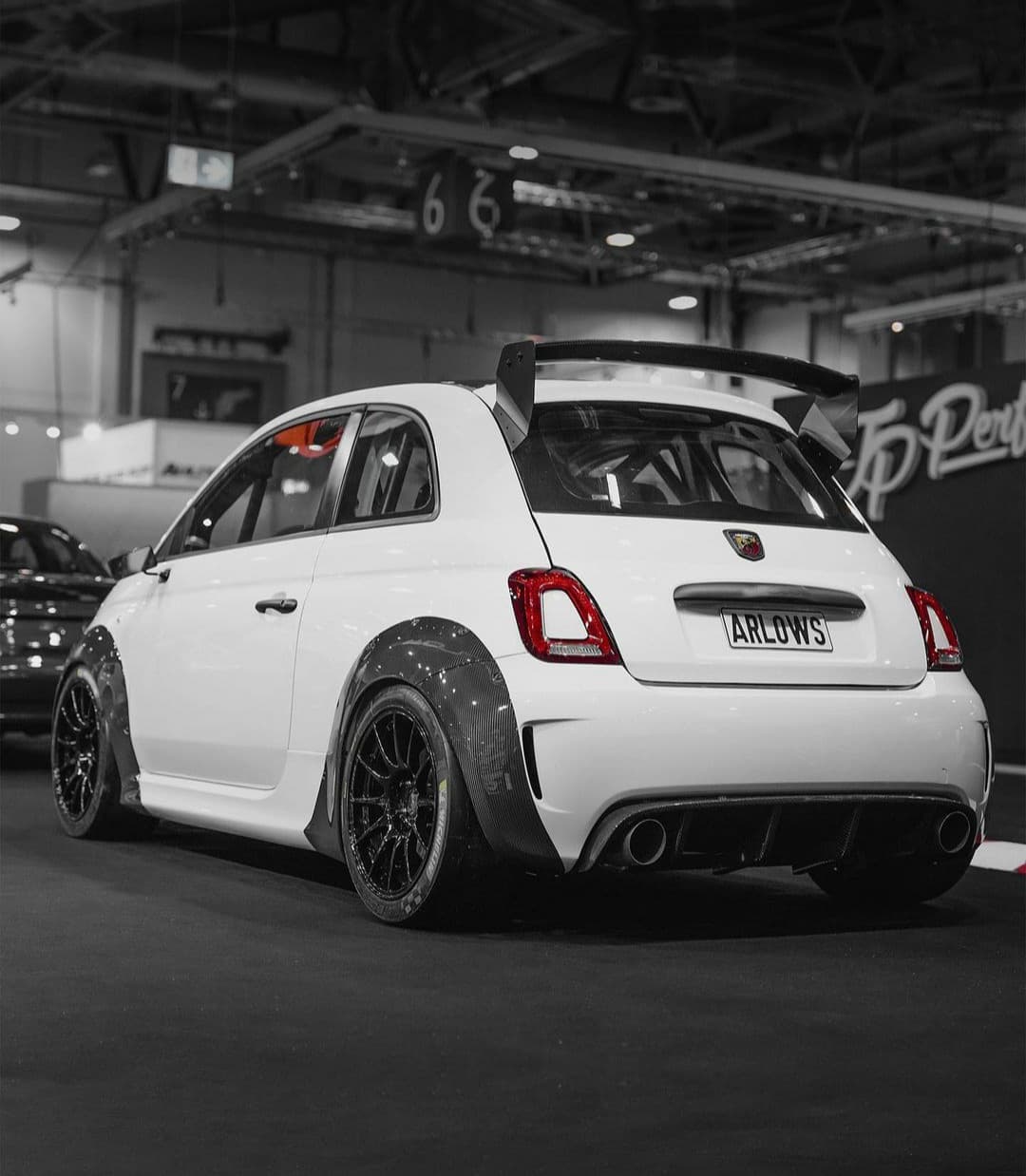 White Abarth 500 with racing suspension in the workshop