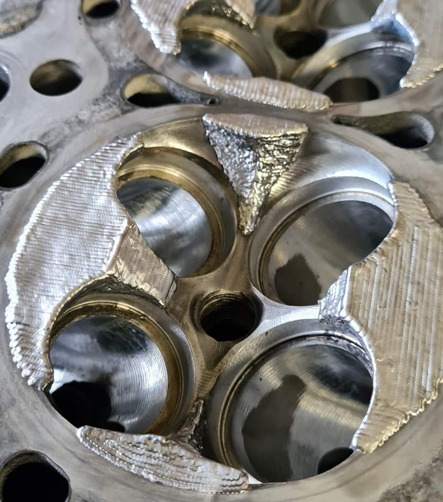 Fresh laser weld seam on a cylinder head combustion chamber