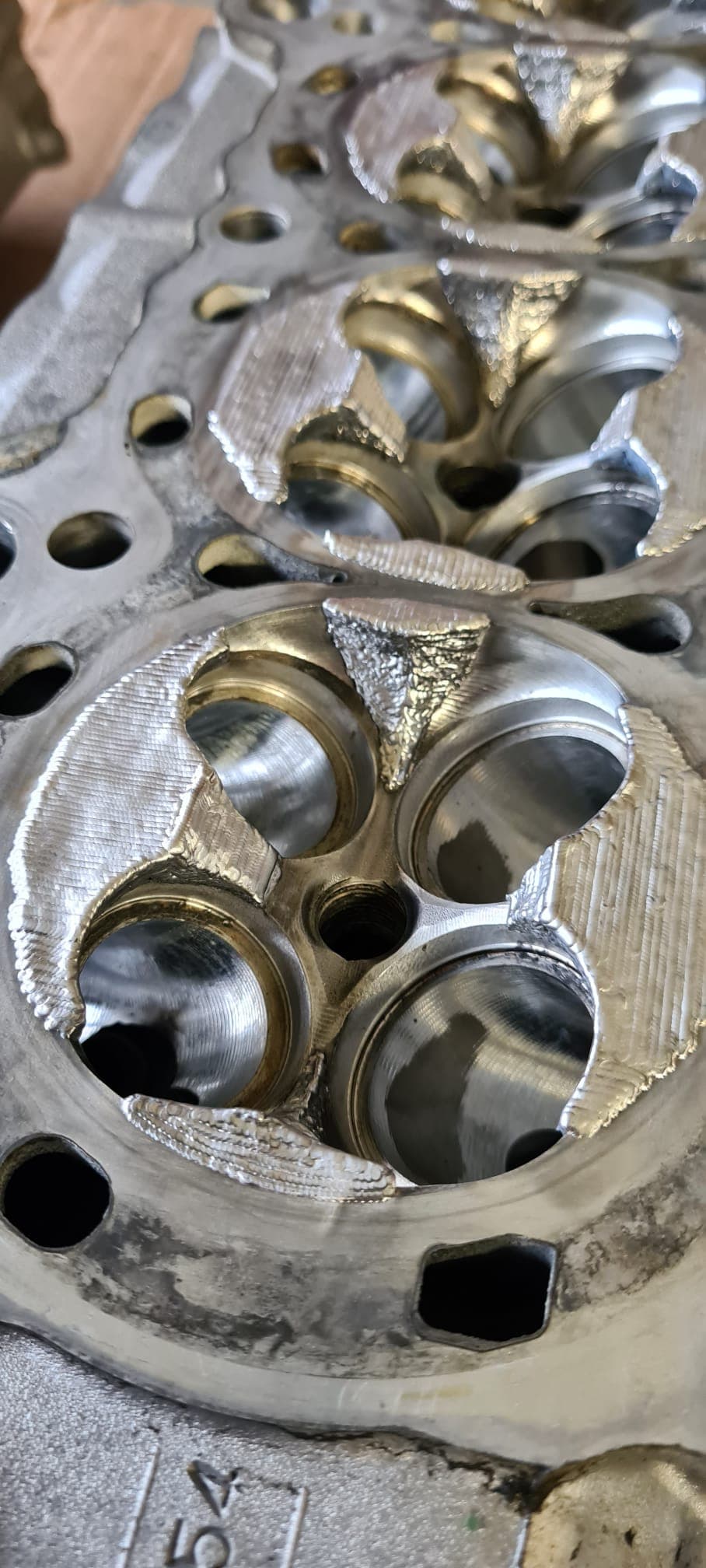 Fresh laser weld seam on a cylinder head combustion chamber