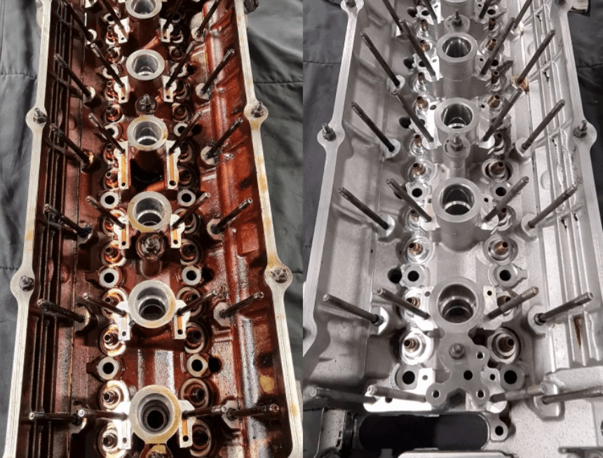 Cleaned valve cover after reconditioning, with bare polished aluminum